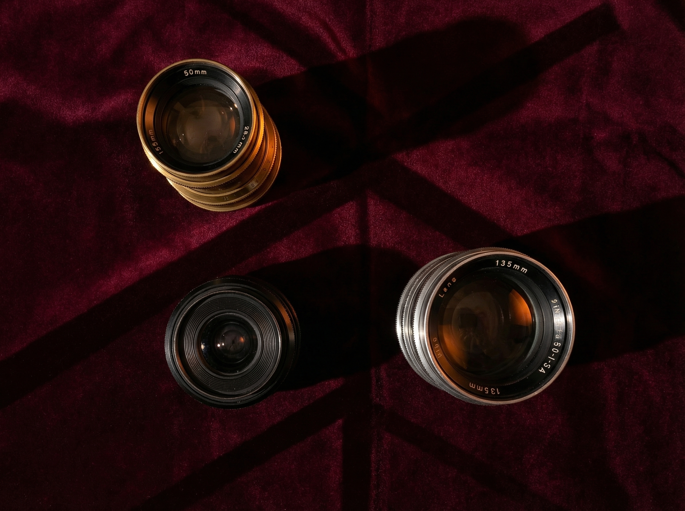 Three lenses arranged in triangle formation