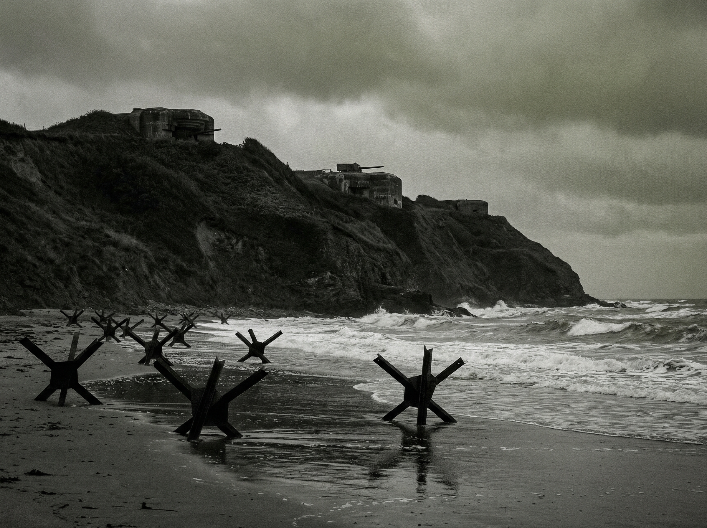 Dramatic view of Omaha Beach with towering bluffs and steel obstacles