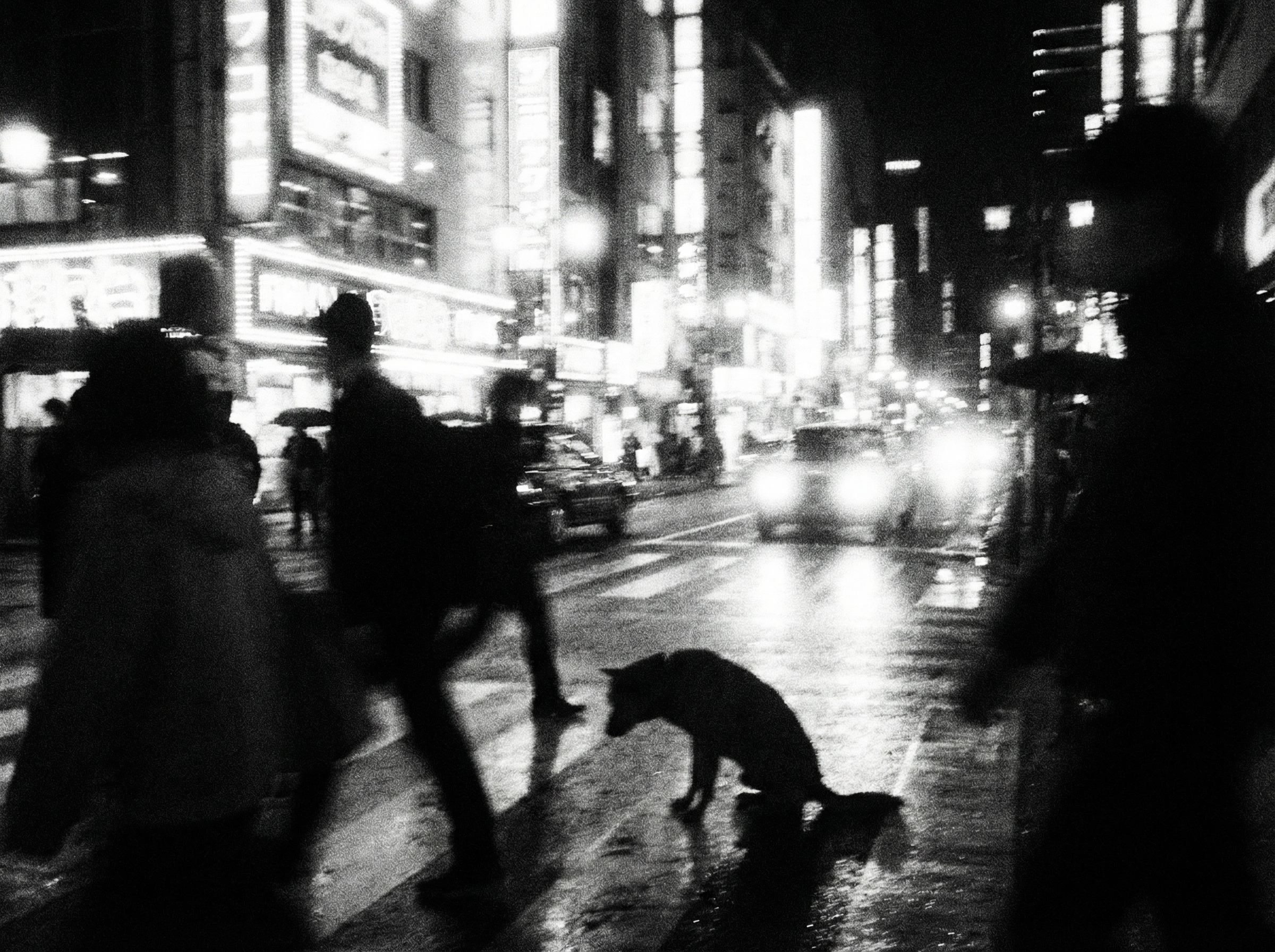 Extreme high contrast grainy black and white Tokyo nightscape with blurred neon signs