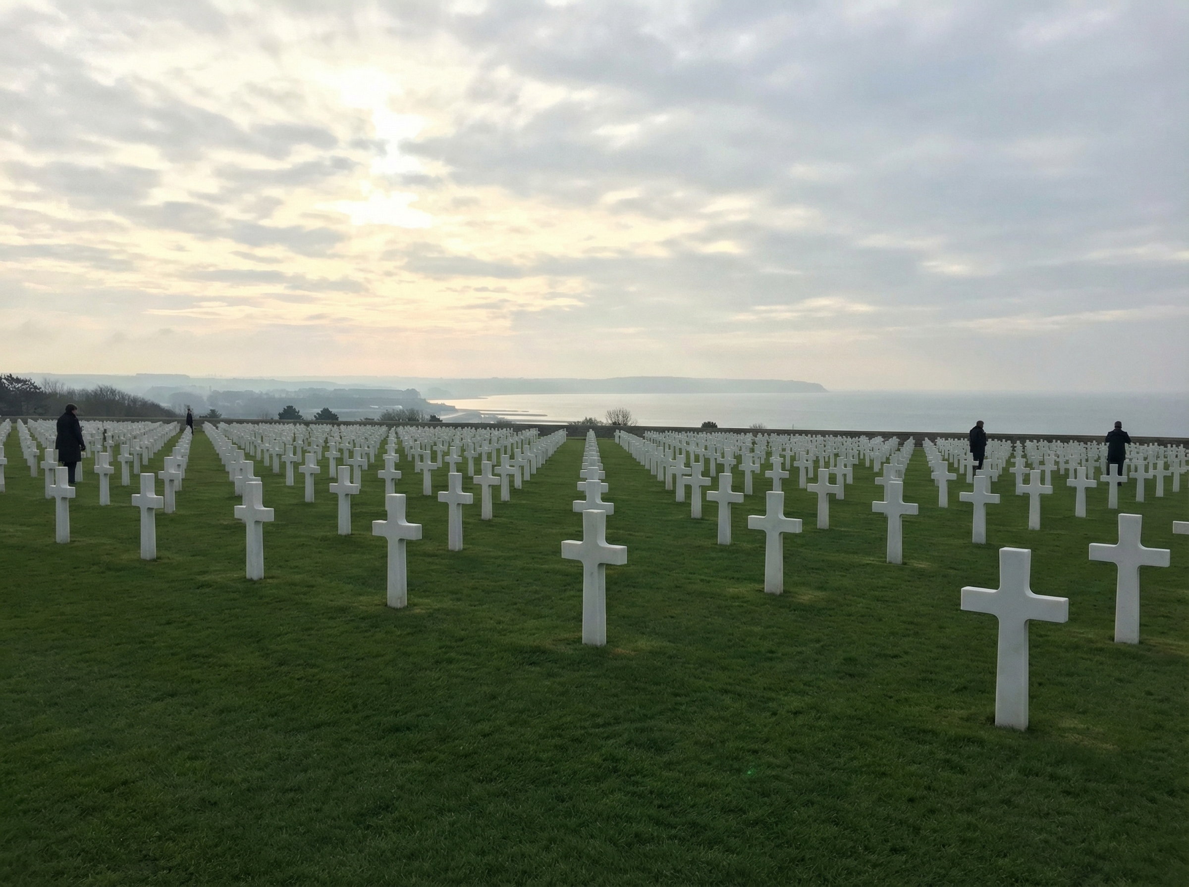Rows of white marble crosses at American Cemetery overlooking Normandy beach