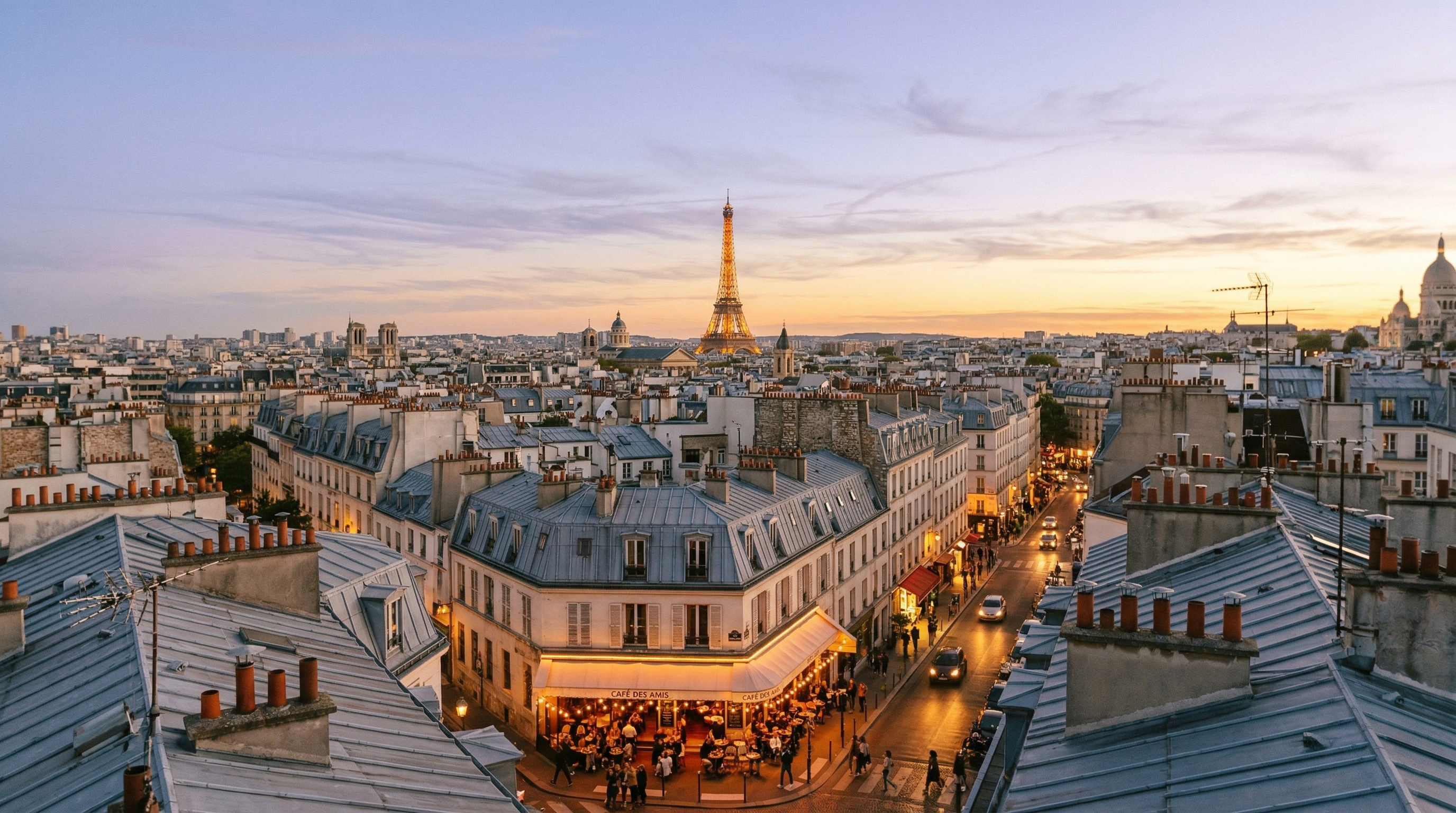 Golden-hour panorama of Paris rooftops from Montmartre, with the Eiffel Tower glowing amber in the distance and zinc mansard roofs stretching to the horizon